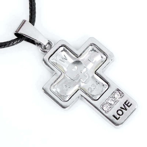 Detailed view of silver cross pendant with skull motif, LOVE engraving and small zircons