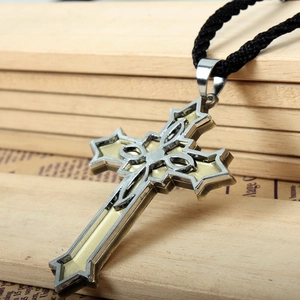 Vintage Victorian titanium steel cross pendant with yellow enamel inlay on a black cord