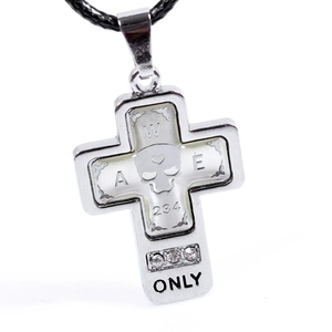 Detail of silver gothic cross pendant with skull motif, clear rhinestones and ONLY text