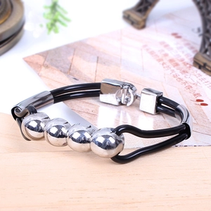 Close-up of black PU leather cord bracelet with five silver alloy beads and plug-in clasp