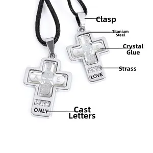 Detail of titanium steel cross pendants with skull motifs and ONLY LOVE engravings