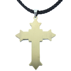 Detail of a Victorian style gold cross pendant with gothic points and black cord necklace