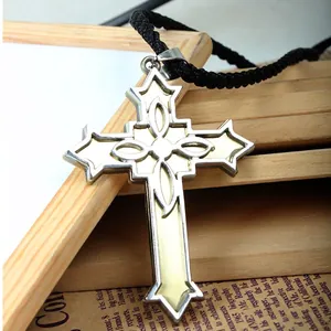 Victorian style cross necklace with silver metal frame and beige center on a woven rope