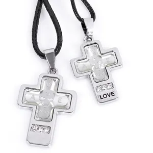 Punk style stainless steel cross pendant with skull detail and crystal accents