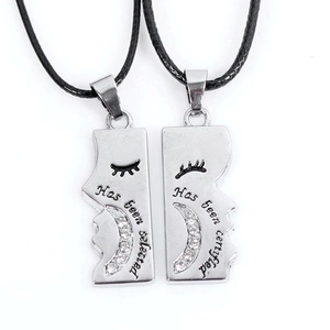 Coupled moon and face profile pendant necklace with rhinestones and engraved text