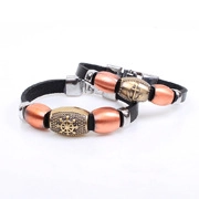 Detailed view of vintage leather bracelets with rudder and cross charms in 2-piece set