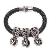 Macro shot of black braided leather bracelet featuring three silver cobra pendants