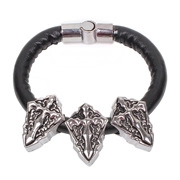 Close-up of black leather punk bracelet with three silver gothic cross shield charms