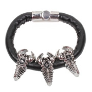 Detail of black leather punk bracelet featuring three silver scorpion charms and metal clasp