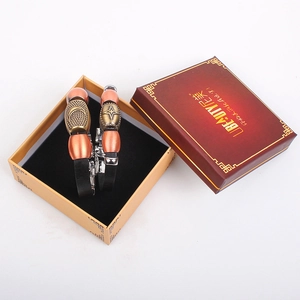 Macro view of vintage leather couple bracelets with moon and star metal charms in a gift box