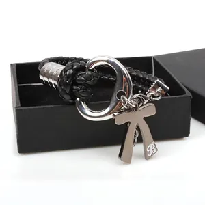 Multilayer black woven leather bracelet with silver bow pendant in a square jewelry box