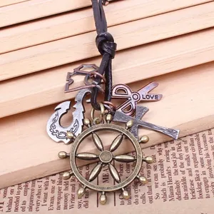 Retro nautical necklace with bronze ship wheel, anchor, and scissors on black leather cord