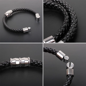 Macro views of black braided leather bracelet with silver polished magnetic metal clasp