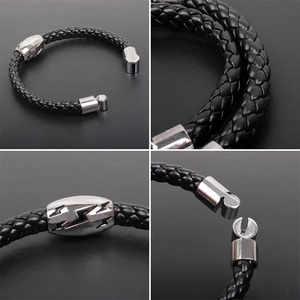 Detail view of black braided leather bracelet featuring lightning pattern and magnetic clasp