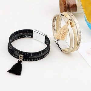 Multilayer leather bracelet with tassel charm and magnetic buckle closure in black and beige