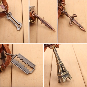 Leather cord bracelet with Eiffel Tower and sword pendants in retro bronze finish