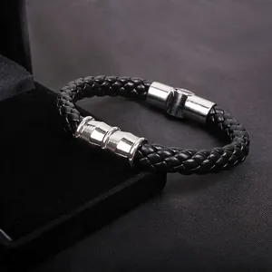 Men's punk style black woven leather bracelet with polished silver steel accents