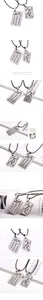 Macro detail of alloy couple pendant necklaces with engraved heart and arrow patterns