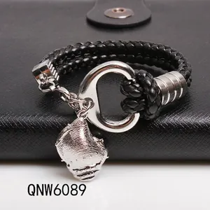 Men's black braided leather bracelet featuring a silver conch shell charm and C-clasp