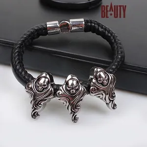 Men's punk braided black leather bracelet with three silver skull charms and magnetic clasp