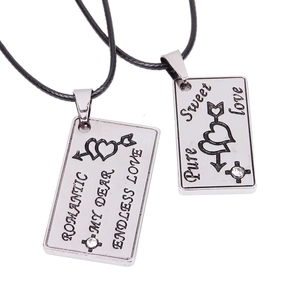 Couple necklaces with silver rectangular heart pendants and arrow motif in silver finish