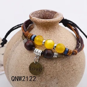Handmade bohemian layered bracelet set with leather ropes, wood beads and Love charm