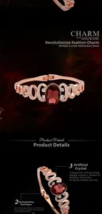 Detail of rose gold bracelet featuring an oval red crystal and 18K gold plated finish