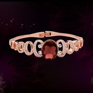 Elegant rose gold bracelet with large oval ruby gemstone and sparkling zircon accents