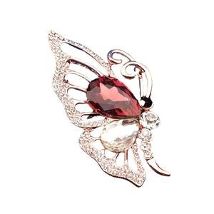Broche papillon exquise avec gemme rouge poire et strass pavés sur monture or rose