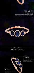 Detail of rose gold bangle with three oval blue crystals and pave set rhinestones