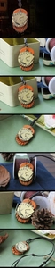 Macro detail of vintage leather pendant necklace with bronze poker cards and metal rings