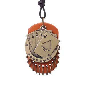Vintage spade poker pendant necklace in bronze metal and orange leather on dark cord