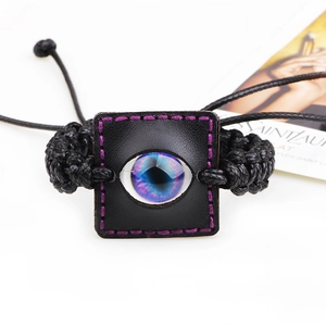 Exotic vintage braided leather bracelet with colorful evil eye crystal and purple stitching