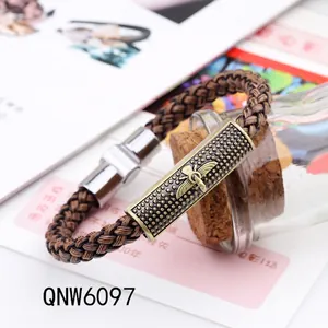 Vintage woven leather bracelet featuring a bronze bee emblem on a textured metal plate