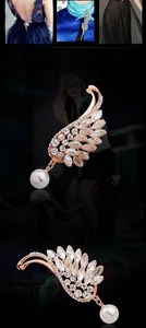 Dettaglio di una spilla a forma di piuma oro rosa con cristalli e perla bianca pendente