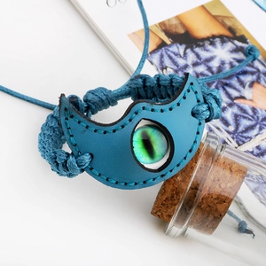Evil eye leather bracelet with luminous stone and woven rope in ethnic style
