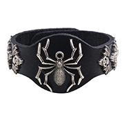 Detail of black leather punk bracelet featuring a large silver spider and skull ornaments