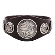 Detail of wide brown leather bracelet with silver Indian head and eagle relief rivets
