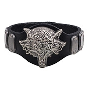 Detailed view of punk black leather wristband with silver metal wolf head and rivets