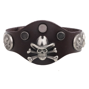 Vintage punk wide leather bracelet with metal skull centerpiece and rivet studs