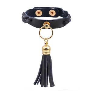 Chic black leather choker with gold ring and long fringe tassel in punk fashion style