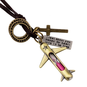 Retro bronze airplane necklace with pink hourglass and leather cord on white background