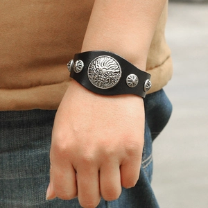 Retro punk black leather bracelet with embossed silver dragon medallion and metal studs