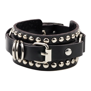 Punk black leather bracelet with silver metal rivets and rings on a white background