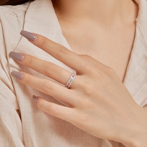 Close-up of S925 sterling silver ring with colorful zircons worn on model finger