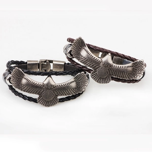 Vintage braided leather bracelets with antique silver eagle pendants for men in black and brown