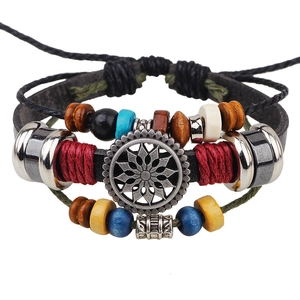 Vintage bohemian leather bracelet featuring a sunflower charm and colorful wooden beads