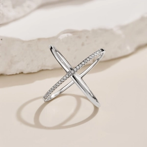 Detailed view of S925 sterling silver X-shaped ring with pavé-set cubic zirconia accents