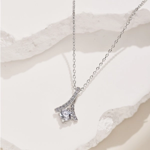 Macro shot of a S925 silver pendant necklace with a large round diamond on stone