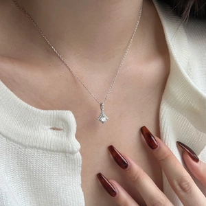 Luxurious S925 sterling silver necklace with sparkling square pendant on elegant model